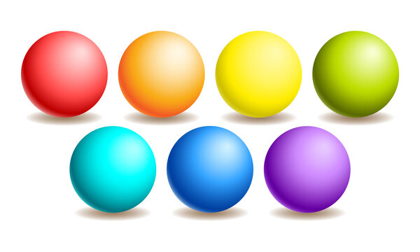 Set of volumetric and glossy spheres of rainbow colors on a white background.