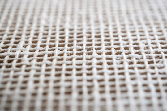 tejido de tela entrelazado formando cuadrados con hilos