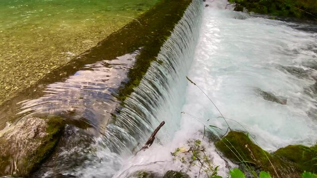 Kamniska Bistrica, Slovenia - July 20, 2021: Waterfall in Kamniska Bistrica at the source , close-up view on the water