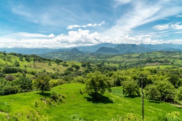 Fototapeta na wymiar Panoramic landscape in Tamesis with blue sky and mountain on the horizon. Colombia. 