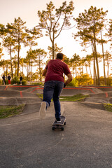 Skateboarder practice on a pump track park