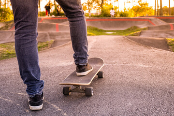 Skateboarder practice on a pump track park