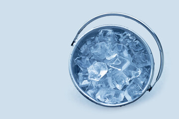 Bucket with ice on white background