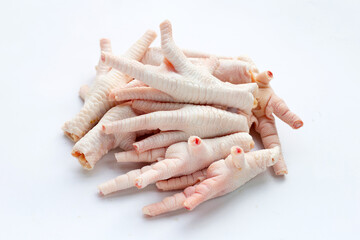 Raw chicken feet on white background