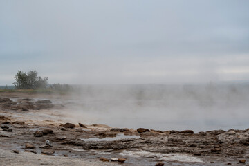 Landscape of steam coming off of Geysir Golden Circle Iceland