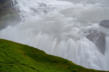Landscape of plant growing in mineral build up at Geysir Golden Circle Iceland