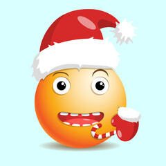 New year happy emoji with santa hat and lollipop in hand.
