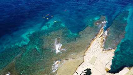 Aerial View Of Kayaks In Turquoise Sea