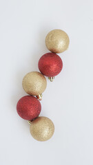golden and red shiny christmas balls close up
