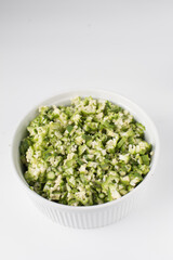Chopped okra in a white ramekin, chopped lady fingers 