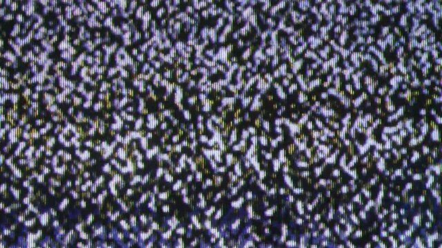 Close up view at a plasma tv while showing television activity.