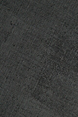 dark creative background: black primed linen canvas, uneven lighting, toning
