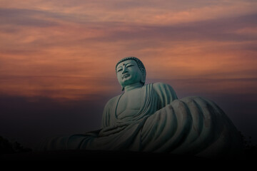 A silhouette of Daibutsu or Great Buddha of Lampang. The Monumental bronze statue of the Great Buddha in Thailand.