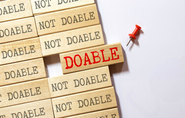 doable colorful word on the wooden background.