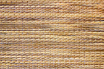 Naturalne tło z brązowej, słomianej maty