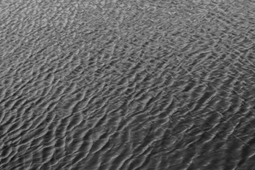 ripples of water. restless river. background with water.
