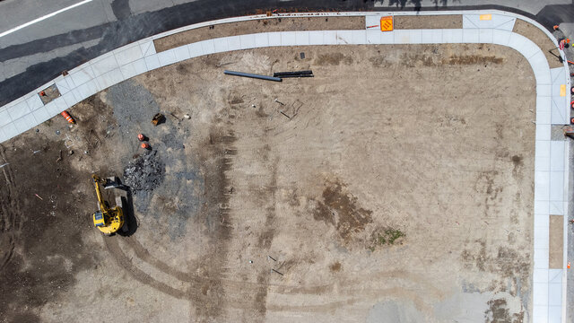 Housing development in rural neighborhood. Aerial view captured by drone as lot is under construction. 
