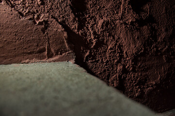 Dark brown stone old concrete wall background texture grunge and brown surface