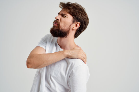 man holding neck arthritis health problems isolated background