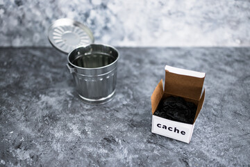 online privacy and stored information, metaphor of box with Cache label next to recycle bin © faithie