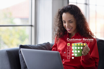 Customer satisfaction survey experience concept, happy latin woman drinking coffee and pressing smiling face icon with five star excellent rating for service evaluation on computer virtual screen