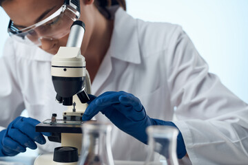 female doctor chemical solutions biologist research study light background