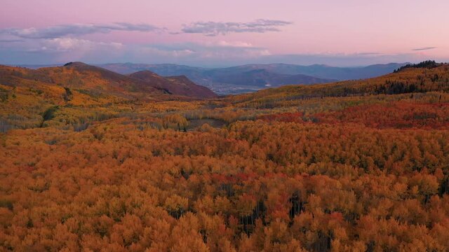 Wide aerial view of colorful Autumn landscape in the Utah mountains a sunset looking towards Heber City.