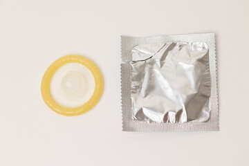 Condom package mockup put on the white table isolated.