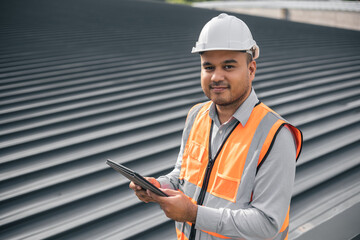 Asian male architect or engineer using tablet control planning construction building. Civil...