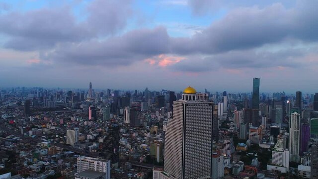 Bangkok thailand aerial city view drone footage over the city. skyscraper and high rise buildings at sunset. 4k aerial city
