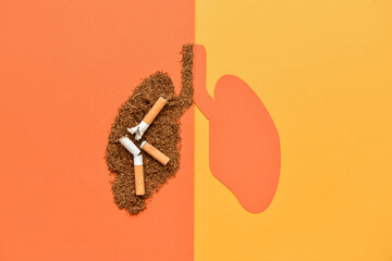 Paper lungs with cigarettes and tobacco on orange background - obrazy, fototapety, plakaty