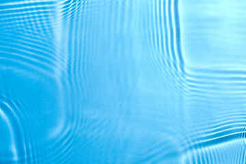 Naklejka na ściany i meble Texture of water with ripples on blue background. Ocean day concept