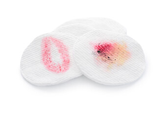 Dirty cotton pads on white background