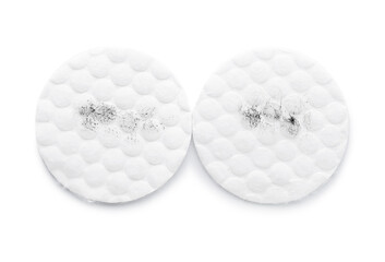 Dirty cotton pads on white background