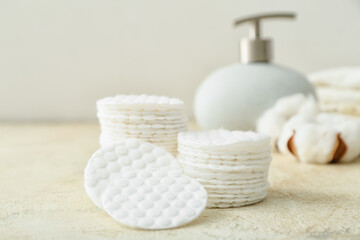Stacks of cotton pads on light table, closeup