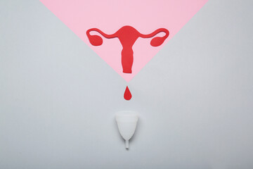 Composition with menstrual cup on color background