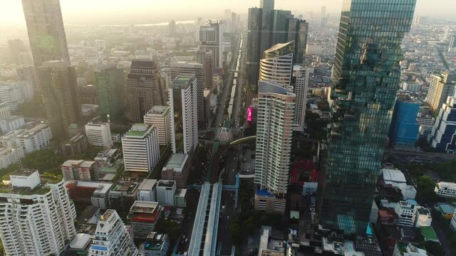 Bangkok thailand aerial city view drone footage over the city. skyscraper and high rise buildings at sunset. 4k aerial city
