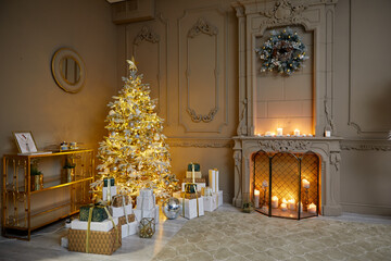 Room decorated to christmas celebration rental studio. Room decorated to christmas celebration studio. White Christmas tree with white and gold balls in a dark room with a decorative fireplace and can