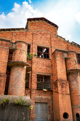 Abandoned red brick factory building in a Chinese city