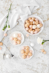 Plates with tasty meringues on grunge background