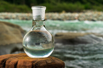 Glass flask with clean drinking water.