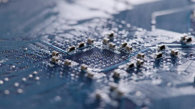 Computer electronic circuit board with radial conductor tracks and SMD capacitors rotating macro