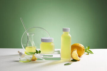 Fototapeta premium Lemon extract with transparent podium with test tube in green background , green leaf , sliced lemon for advertising , frontview , photography experiment concept 