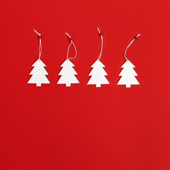 Christmas greeting card with handmade white Christmas tree on red background. Winter Holiday concept.