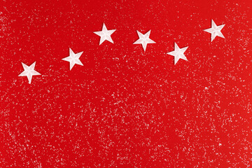 Christmas composition with White stars on red background with bright glitters. Winter Holiday concept. Star sky Surreal.