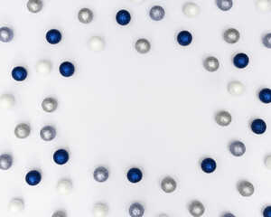 Christmas frame with sparkly blue and silver Christmas balls. New Year decorative border for holiday wishes