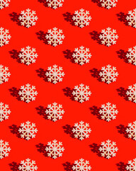 Christmas pattern with wooden snowflake on red Decoration for winter celebration New Year holiday concept.