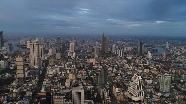 Bangkok Thailand Aerial City View Drone Footage over the City. Skyscraper and high-rise buildings at sunset.
