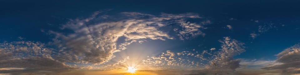 Golden sunset sky pano with Cumulus clouds. Seamless hdr panorama in spherical equirectangular format. Complete zenith for 3D visualization, game and sky replacement for aerial drone 360 panoramas.