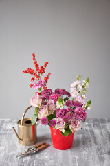 Finished flower arrangement in a vase for home. Flowers bunch, set for interior. Fresh cut flowers for decoration home. European floral shop. Delivery fresh cut flower.